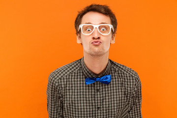 Obraz premium Portrait romantic man, send kiss at camera .Showing lips.
