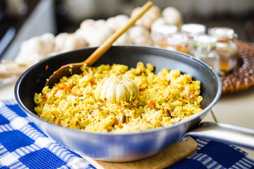 Top View of Pilaf with Beef, Carrots, Onions, Garlic and Spices, Traditional Dish of Asian Cuisine, Selective Focus