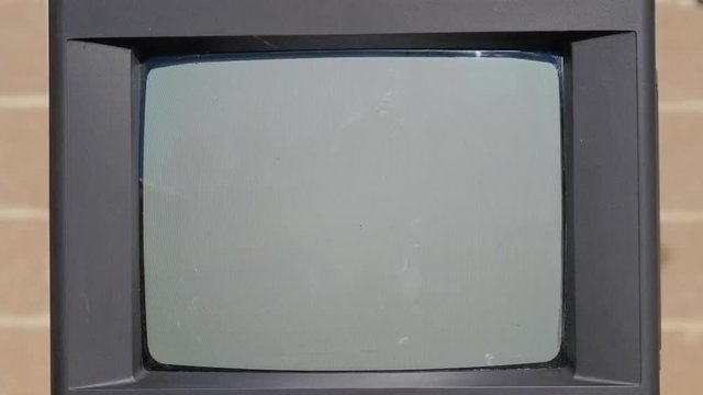 Break the old TV with a big kvadlly. The glass screen shatters to smithereens