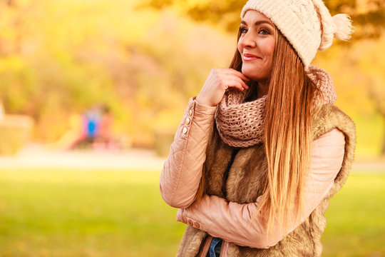 Woman walking in park during autumn