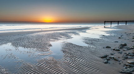 Omaha beach near Vierville-sur-Mer on a summer morning sunrise - obrazy, fototapety, plakaty