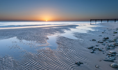 Omaha beach near Vierville-sur-Mer on a summer morning sunrise