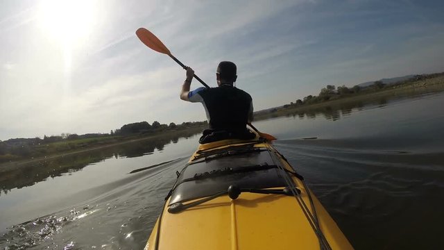 Kayaker paddling speed up