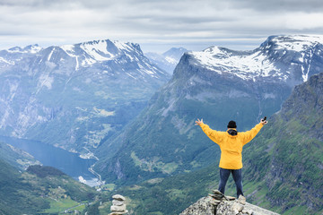 Tourist man on Dalsnibba viewpoint Norway