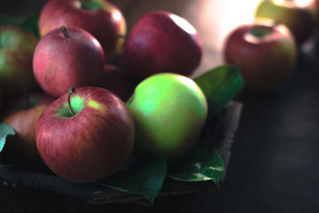 Fresh ripe apples on a wooden background. Autumn still life.