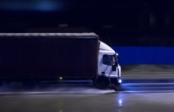 truck moves overnight on a wet road