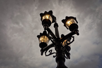 Street light with a clear grey sky as the background