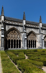 Fototapeta na wymiar Cloisters of the Batalha Monastery, a prime example of Portuguese Gothic architecture, UNESCO World Heritage site, started in 1386 but never actually completed.