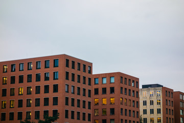 Fototapeta premium typical brick office buildings on a cloudy background