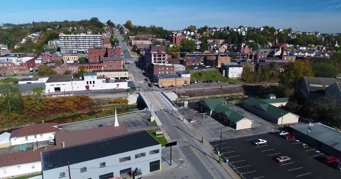 A forward rising aerial establishing shot of the business district of Canonsburg, Pennsylvania, a small town south of Pittsburgh, PA.  	