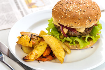grilled beef burger with potato wedges