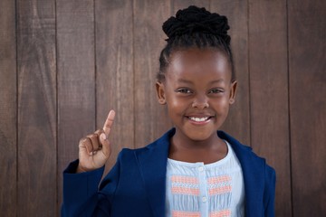 Portrait of smiling confident businesswoman gesturing