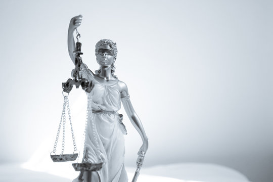 Woman statue symbol of justice Themis
