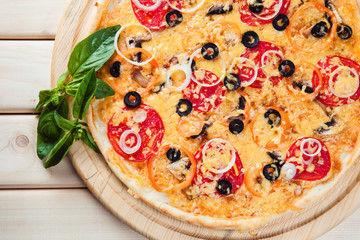 Assorted Pizza on the wooden background