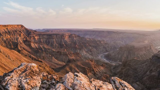 Panorama from above on the Fish River Canyon, scenic travel destination in Southern Namibia. Last sunlight on the mountain ridges.