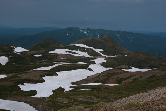 Panoramic view on green slopes around Mount Kurodake, Daisetsuzan National Park, Hokkaido, Japan