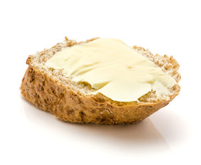 One wheat bran bread snack with butter isolated on white background