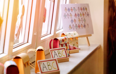 Paper decorations on a school window. Children imagination