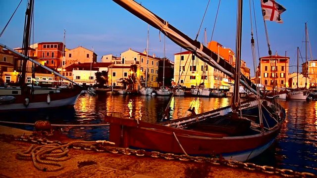 Boat in La Maddalena harbor at sunset. Sardinia, Italy