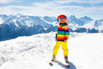 Kids winter snow sport. Children ski. Family skiing.