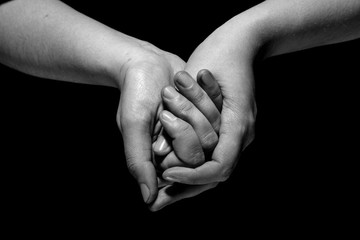 Fototapeta premium hands in mudra gesture on black background