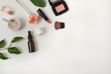 Obraz premium Cosmetic package containers with green leaves, pink salt,herbal . natural organic beauty product concept mock up. Blank bottle for label own branding skincare. isolated white background.top view.