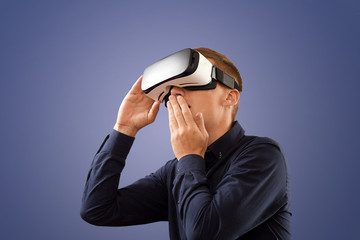 Smartphone using with VR glasses. Man wearing virtual reality glasses. Virtual reality today.