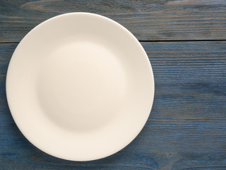 plate on a wooden background. plate top view. copy space