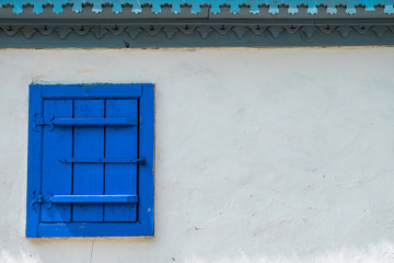 Old wooden window, part of a traditional Romanian village house