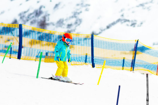 Kids winter snow sport. Children ski. Family skiing.