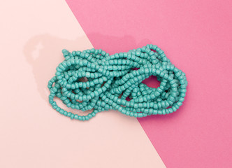 Fototapeta premium Bead Neckless on a Duel Colored Background