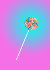 Colorful rainbow lollipop swirl on stick isolated on sweet pastel color background.