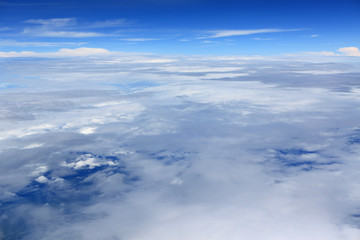 Fototapeta na wymiar The cloud sky view from aeroplane window.