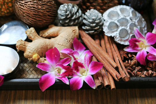 Orchid flower on wooden tray, Health care and spa concept. Nature spa ingredient.