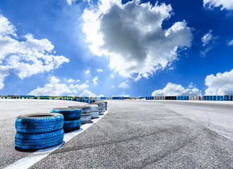 Asphalt road circuit and sky clouds with car tire brake © ABCDstock