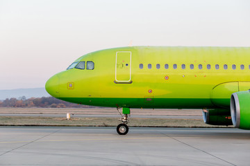 Commercial jet aircraft on runway. Airplane's fuselage. Aviation and transportation.