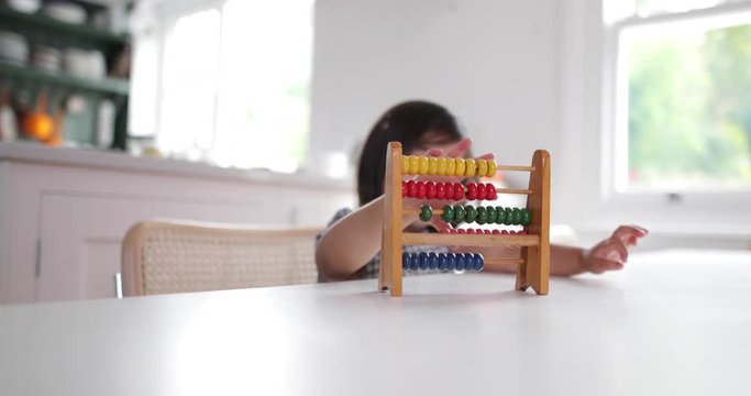 Girl using abacus to count