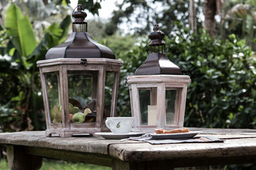 Picnic dinner serving with cherry pie and lanterns decoration- outside at the backyard or park