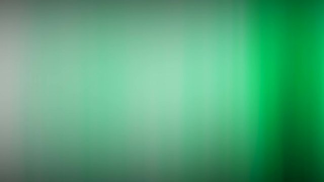 green transverse rays move slowly against a white background