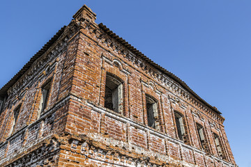 Fototapeta premium The old abandoned historic building of red brick.