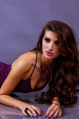 Fototapeta premium beautiful girl with long hair in purple dress