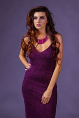 beautiful girl with long hair in purple dress