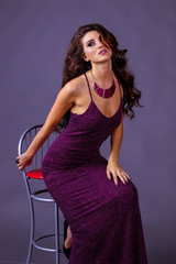 beautiful girl with long hair in purple dress
