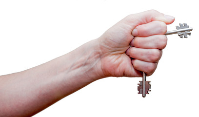 Female fist with clipped keys. Using of improvised stuff (door keys) for protection. The blow with such fist will cause more damage. Self-defense concept. Isolated on white background.
