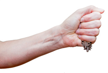 Female fist with clipped keys. Using of improvised stuff (door keys) for protection. The blow with such fist will cause more damage. Self-defense concept. Isolated on white background.