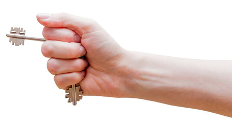 Female fist with clipped keys. Using of improvised stuff (door keys) for protection. The blow with such fist will cause more damage. Self-defense concept. Isolated on white background.