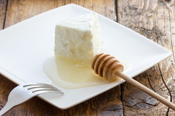 Tasty fresh cow Ricotta cheese with honey