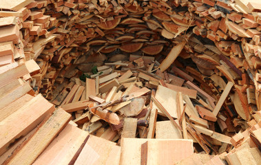 circular wood-burning lumber with many pieces of cut wood