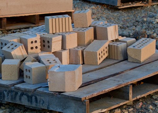 Tan bricks on a pallet - Powered by Adobe