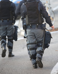police patrol in riot police with gun and pistol during revolt